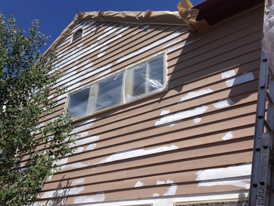 Peak Pro Painting prepping the exterior of a Denver area home for fresh paint.
